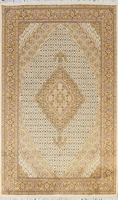 an antique persian rug is shown in white and gold