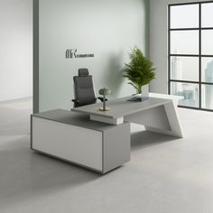 an office desk with a chair and potted plant