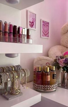 a white teddy bear sitting on top of a shelf in a room filled with cosmetics