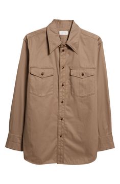 Based on '70s-era Western shirts but updated with clean, pared-back details, this look is made from cotton twill with a soft hand and excellent drape. 31" length; 45" chest (size 48 EU) Front button closure Point collar Long sleeves with three-button cuffs Chest button-flap patch pockets Curved hem 100% cotton Dry clean Imported Designer Clothing Brown Cotton Shirt For Work, Brown Cotton Shirt With Buttoned Pockets, Unstructured Shirt With Snap Buttons For Work, Classic Khaki Shirt With Button Cuffs, Brown Shirt With Welt Pockets For Work, Classic Brown Unstructured Top, Brown Cotton Top With Flap Pockets, Classic Brown Shirt With Buttoned Pockets, Classic Khaki Shirt With Lapel Collar