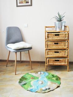 a living room with a chair and a rug on the floor next to a dresser