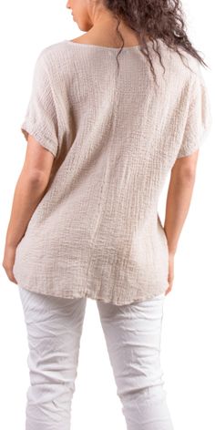 Lightweight and Breathable Waffle Cotton Top. Features a V-Neck with Cap Sleeves. 97% Cotton | 3% Elastic Made in Italy One Size Model 5'7" Textured Tops For Beach, Spring Season, Textured Tops For Beach In Spring, Textured Tops For The Beach In Spring, Textured Tops For Spring Beach Outings, Textured Top For Spring Layering, Casual Textured Tops For Layering, Textured Beach Tops, Casual Solid Color Textured Tops, Linen V-neck Top For Layering