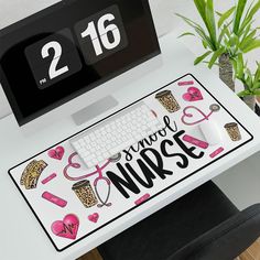 a desk with a computer, keyboard and mouse on it next to a potted plant