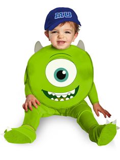 a little boy in a green costume with big eyes