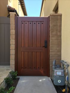 a large wooden door in front of a house