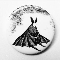 a button with a bat drawn on it