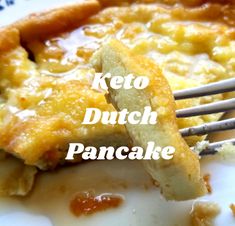 a piece of cake that is on a plate with a fork in it and the words keto dutch pancake