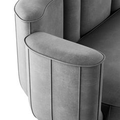 an upholstered chair with curved backrests