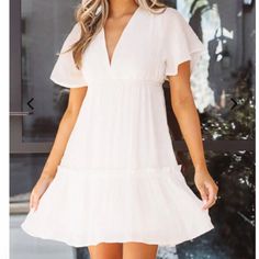 White Mini Dress With Open Back White Lined V-neck Midi Dress, White Flowy Mini Dress For Date Night, White Short Sleeve Lined Mini Dress, White Lined Mini Dress With Short Sleeves, White Short Sleeve Lined Midi Dress, Chic Flowy Mini Dress With Short Sleeves, Velvet Halter Dress, Green Short Sleeve Dress, Floral Mesh Dress