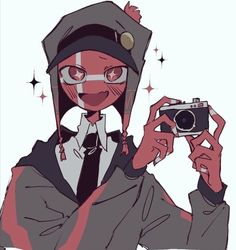 a person holding a camera in front of their face while wearing a hood and glasses