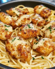 pasta with chicken and sauce in a pan