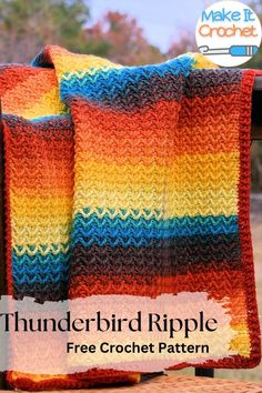 a colorful crocheted blanket sitting on top of a wooden bench next to a sign that says thunderbird ripple free crochet pattern