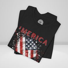 Show your unwavering support with our American Patriot T-shirt! This tee proudly features a grunge style American Flag with the bold statement ''Merica' making this T-shirt a stylish choice for a true American patriot. Product details This classic unisex jersey short sleeve tee fits like a well-loved favorite. Soft cotton and quality print make users fall in love with it over and over again. These t-shirts have-ribbed knit collars to bolster shaping. The shoulders are tapered for a better fit over time. Dual side seams hold the garment's shape for longer. >Bella Canvas 3001 TShirt >This t-shirt comes with a lightweight fabric (4.2 oz/yd² (142 g/m²)) >The tear-away label minimizes skin irritations and provides a scratch-free wearing experience. >Fabric blends: Ash - 99% Airlume combed and r Independence Day Streetwear T-shirt Crew Neck, Independence Day Graphic Tee With Sublimation Print, Independence Day Graphic Tee With Graphic Print, Patriotic Black Shirt With Graphic Print, Black Patriotic Shirt With Graphic Print, Black Patriotic Graphic Print Shirt, Black Graphic T-shirt For Independence Day, Black Graphic Print T-shirt For Independence Day, Independence Day Graphic Tee T-shirt For Streetwear