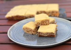 four pieces of cake sitting on top of a plate