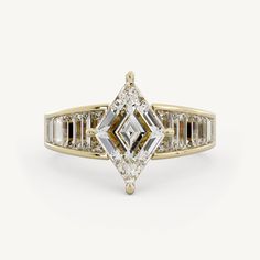 a yellow gold engagement ring with an emerald cut diamond and baguettes on the side