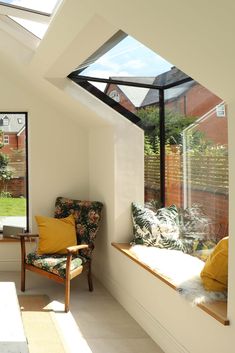 the sun shines in through an open window into a room with two chairs and a bench