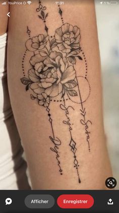 a woman's arm with flowers on it and the words love written in cursive