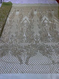 the table cloth is covered with sequins and beads on it's edges