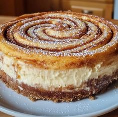 a cake on a plate with powdered sugar