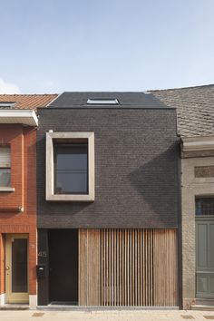 two houses with wooden shutters on each side