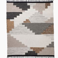 an abstract rug with black and white stripes on the bottom, in front of a white background