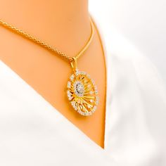 This 18k yellow gold pendant set, weighing 7.1 grams, features a radiant round design adorned with 1.18 carats of round brilliant cut diamonds. The diamonds, with an F-G color and VS clarity, add exceptional brilliance and elegance. The pendant measures 1.1 inches in length, while the matching earrings are 0.6 inches long and come with secure screw back posts. Ideal for those who appreciate luxurious and sophisticated jewelry, this set adds a touch of refined charm to any collection. Its exquisi Dazzling Gold Oval Diamond Necklace, Gold Diamond Necklace With Brilliant Cut Oval Pendant, Gold Plated Diamond Pendant Necklace With Brilliant Cut, Dazzling Gold Diamond Necklace With Halo Design, Gold Diamond Necklace With Flower Pendant And Prong Setting, Yellow Gold Diamond Necklace With Oval Pendant, Gold Flower Pendant Diamond Necklace With Prong Setting, Gold Pendant Set, Round Diamond Pendant