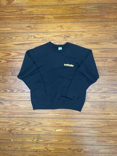 Vintage Meineke Discount Mufflers Sweatshirt > Excellent vintage condition with no imperfections > Retro 90's Meineke raglan sweatshirt > Solid black throughout > Logo graphic on front and back > Great graphic with good color and perfect cracking > Soft 50/50 blend > Elastic cuffs and bottom band > Measures slightly smaller than tag size (measurements below) > Tag size is adult Large - L (measurements below) > Tag:  Fruit of the Loom > 2-sided print > All original tags > American made > 90's era Black Long Sleeve Sweater, Raglan Sweatshirt, Retro 90s, Modern Outfits, Logo Graphic, The Loom, Fruit Of The Loom, American Made, 50 50