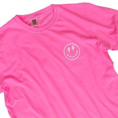 Looking for a neon pink lightning bolt happy face shirt this summer? Look no further! This happy face checkerboard tee is perfect for showing your love for all things preppy and trendy. Made from 100% cotton, this shirt will brighten up your wardrobe and you'll want to wear all year round! This is your ultimate beach summer t-shirt. Fabric: 100% Cotton Design: White heat-applied vinyl Color: Neon Pink (shirt colors are pigment dyed) Colors will vary from computer to computer and monitor to monit Neon Pink Lightning Bolt, Neon Pink Shirt, Neon Pink Shirts, Pink Shirt Outfit, Pink Lightning Bolt, Happy Face Shirt, Pink Lightning, Preppy Tee, Neon Shirts