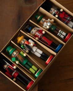 a wooden box filled with lots of different types of toys