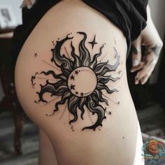 This detailed black sun tattoo on the hip incorporates stars and delicate shading, creating a celestial and unique tattoo design. Perfect for those who love cosmic themes in their body art. Discover more sun tattoo designs at inktat2.com. Goth Sun And Moon Tattoo, Moon Tattoo On Hip, Moon And Stars Hip Tattoo, Female Sun Tattoo, Celestial Thigh Tattoo, Gothic Sun Tattoo, Sunflower And Stars Tattoo, Shading Tattoo Ideas, Sun And Moon Hip Tattoo