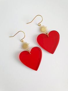 Beautiful pair of red heart earrings. These earrings are designed for pierced ears and made with see through red acrylic heart charm (31mm x 31mm) and a brass gold sun shaped connector (18mm x 13mm). Total length (50mm approx)  They come in an organza bag ready for gift giving. If you have any questions regarding shipping and payment, please take a look at my shop policies: http://www.etsy.com/uk/shop/LadyMangoJewellery/policy?ref=shopinfo_policies_leftnav ● Shipping: For customers in the UK you Red Heart Single Earring For Valentine's Day, Red Single Heart Earring For Valentine's Day, Red Heart-shaped Single Earring, Single Red Heart-shaped Earring, Red Double Heart Pierced Earrings, Red Pierced Heart Earrings As Gift, Gold Sun Earrings, Big Earrings Gold, Red Heart Earrings