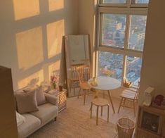 a living room filled with furniture next to a large window overlooking a cityscape