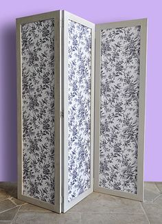 a room divider with floral designs on it