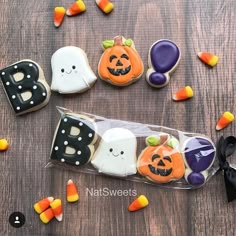 decorated cookies in the shape of ghost, pumpkins and jack - o'- lanterns