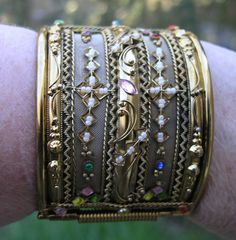 "Wonderfull AMAZING Chunky gold tone stones Bracelet unsigned. 1970's Measures inside 2 1/4 x 2 5/8\" x 2 2/8\" wide. missing a few tiny pearls other wise it's in very good vintage condition" Antique Gold Cuff Bracelet Collectible, Antique Jeweled Gold Bracelets, Collectible Gold Bracelets With Jewels, Antique Gold Hinged Cuff Bracelet, Vintage Wide Band Jewelry With Intricate Design, Antique Gold Cuff Bracelet With 17 Jewels, Gold Jeweled Cuff Bracelet, Gold Jeweled Cuff Bracelet Bangle, Gold Bracelets With Jewels For Collectors