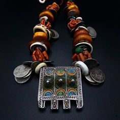 Absolutely stunning Moroccan necklace with coral, amber, shells and silver coin beads. The centre amulet is a gorgeous rectangular silver piece with  enamel detailing. Absolutely stunning and rare. Moroccan Necklace, Berber Jewelry, Amber Beads, Ancient Coins, Silver Coin, Silver Pieces, Ethnic Jewelry, Silver Coins, Jewelry Art