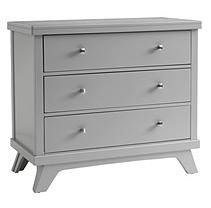 a white dresser with three drawers on it