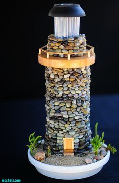 a small tower made out of rocks with a light on top