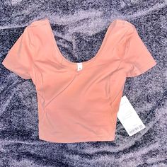 Nwt Lululemon Align Tee Buttery Soft Nulu Fabric Is Sweat Wicking And Four Way Stretch, Maintains Shape And Retention, Slim Fit Cropped Length Fitted T-shirt For Yoga In Spring, Fitted Pink T-shirt For Loungewear, Athleisure Scoop Neck Tops For Yoga, Sporty Scoop Neck Yoga Tops, Moisture-wicking Scoop Neck Tops For Yoga, Pink Short Sleeve Activewear For Loungewear, Athleisure Scoop Neck Tops For Light Exercise, Pink Short Sleeve Activewear For Casual Wear, Scoop Neck Tops For Light Exercise, Athleisure Style