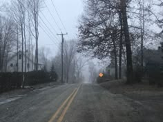 an empty road in the middle of winter