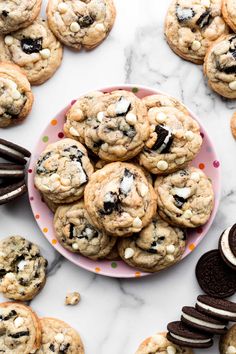 chocolate chip cookies and oreos on a pink plate