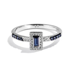 a white gold ring with blue and white diamonds