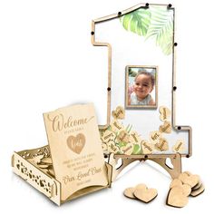 a wooden photo frame with hearts on it and a card in the shape of a heart