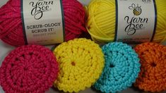 several balls of yarn sitting next to each other