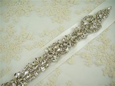 "Exquisite rhinestone applique - high quality crystal rhinestone. Size: Width: 1.9\" (5 cm) Length: 32.7\" (83 cm) Perfect for a DIY bridal garter, bridal dress, wedding dress, bridal sash, belts, headpiece, baby headband (as well as many other DIY projects). Stones are all prong set, and sewn into the mesh backing. Application: Heat Press, Sew on, Iron on Price is for one piece, more in stock. We offer special discounts for designers and wholesale orders! You can choose a express shipping here: White Crystal Embellished Sash, White Crystal Embellished Sashes, White Embellished Crystal Sashes, Glam Living Room Decor, Wedding Dress Evening, Bridal Sash Belt, Diy Bridal, Millinery Hats, Rhinestone Appliques