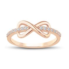 a rose gold ring with diamonds on it