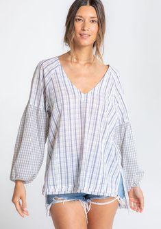 Perfectly relaxed and effortless, this cotton top is designed in a classic mixed plaid print. Featuring voluminous long sleeves, a subtle high/low hemline, and delicate shirring details. The raw unfinished hem adds a lived-in feel. FINAL SALE Mixed plaid print Relaxed, oversize fit Voluminous long sleeve Elastic wrist cuff High/low hemline Raw-edge hem Side vents V-neckline Shirred detail at the back Slightly sheer Cotton shirt Model is 5'9, wearing a size S.Style: I-13864W-RTM-MP Oversized Plaid Shirts, Shirt Model, Wrist Cuffs, Plaid Print, Cotton Top, Raw Edge, Cotton Tops, Plaid Shirt, Oversized Fits