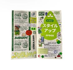 an open book with various stickers and writing on the front cover, in japanese