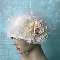 Sophisticated And So Jackie O! Custom Made. Antique French Lace Ostrich Plume And Handmade Rose With Beautiful Large White Rhinestone Brooch For Center Glam. Silk Brim Finish. Brocade Ribbon Detail. It Only Takes A Dash To Accessorize For Your Special Event! Pair With One Of These Amazing Posh Listings And Viola! White Gatsby Wedding Hat, Elegant Cream Headpieces For Wedding, Elegant Cream Wedding Headpiece, Elegant Beige Wedding Headpieces, Cream Gatsby Hat For Wedding, Elegant Fitted Fascinator For Mother Of The Bride, Elegant White Hat For Mother Of The Bride, Elegant Mother Of The Bride Fascinator, Elegant Fitted Headpieces For Mother Of The Bride