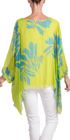 100% Silk Kaftan Style Blouse with Large Leaf Print. Features 3/4 Length Sleeves and a Wavy Bottom. Exterior: 100% Silk Interior: 95% Viscose, 5% Elastic Fits Sizes XS- XL Made in Italy Green Viscose Tops For Vacation, Green Viscose Top For Vacation, Silk Floral Print Beach Top, Summer Viscose Tunic Top, Silk Floral Print Top For Beach, Viscose Beach Blouse, Silk Beach Blouse For Spring, Spring Silk Beach Blouse, Summer Blouse For Beach With 3/4 Sleeves